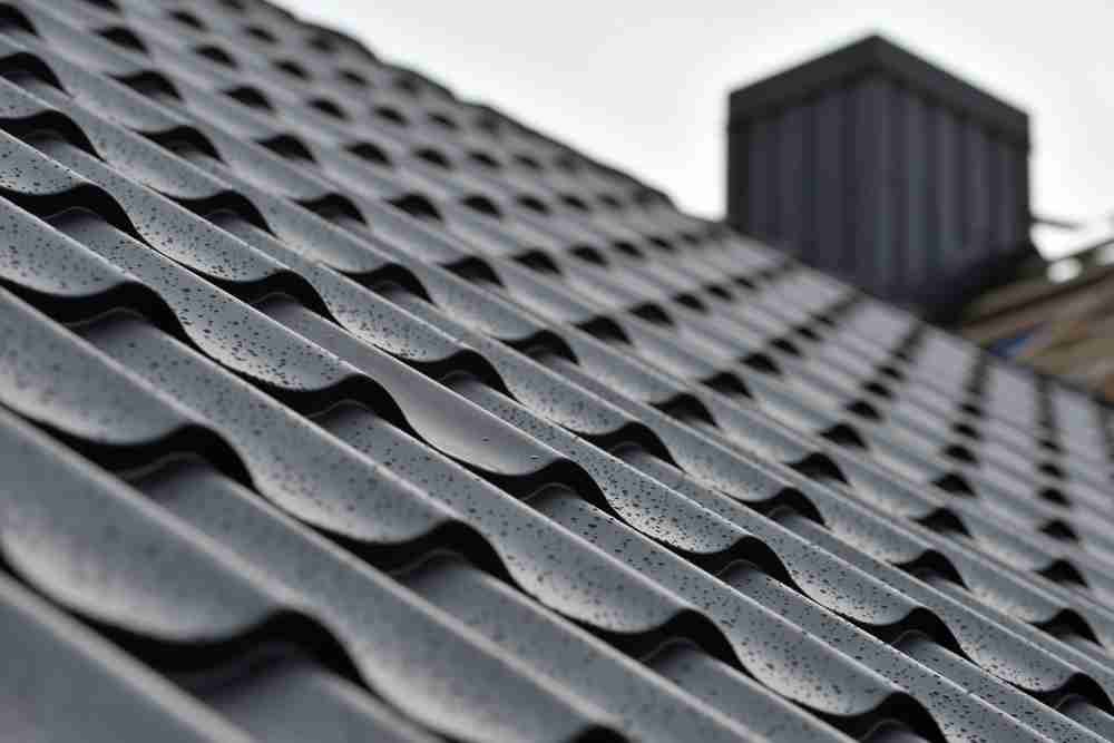 A closeup of metal roofing materials during a storm